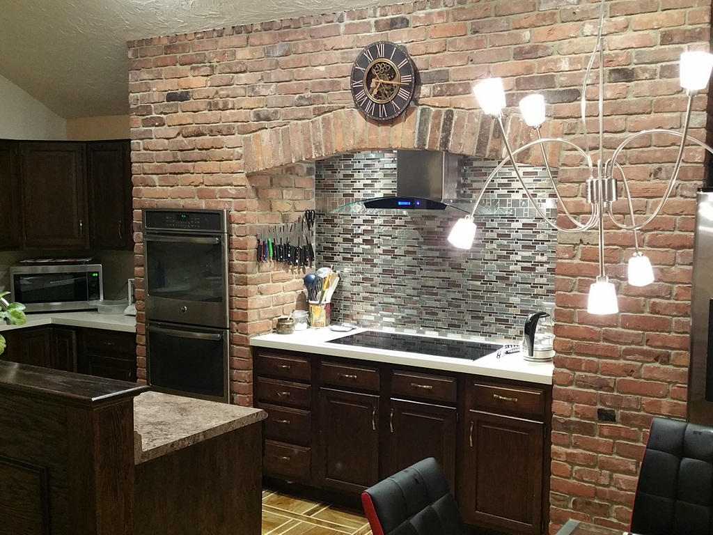 Tile replacement, new light and range hood.
