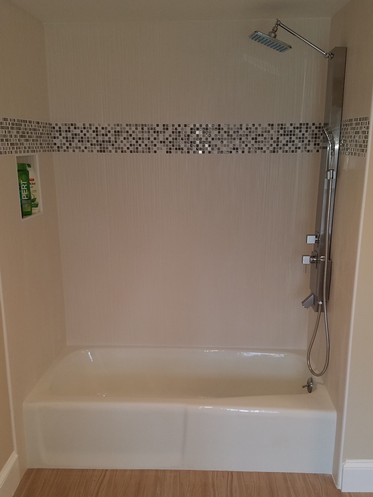 Tile around tub and floor tile installation - after.