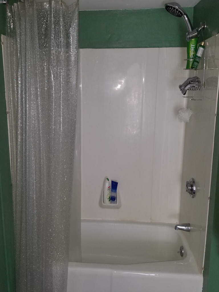 Tile around tub and floor tile installation - before.