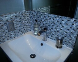Glass mosaic backsplash.
