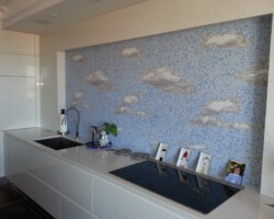 Quartz countertop and frame around mosaic on accent wall.