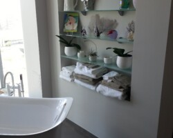 Custom niche with shelving.