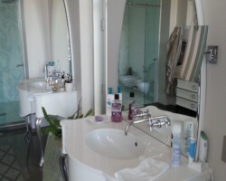 Two personal vanities with mirrors.
