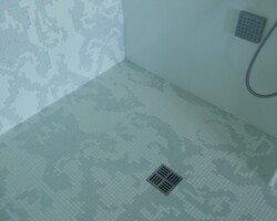 Mosaic transition from wall to floor.