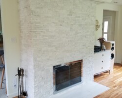 Quartz stones installed around fireplace.