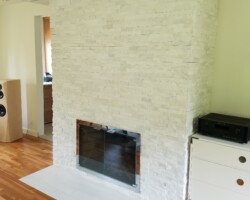Quartz stones installed around fireplace.