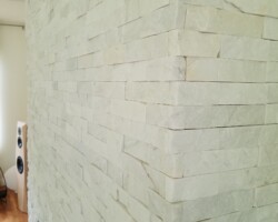 Quartz stones installed around fireplace.