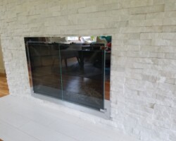 Tiles over chimney hearth.