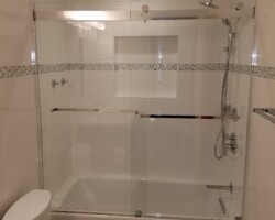 Ceramic tiles around the tub and on the ceiling.