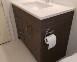 Contemporary vanity with quartz top.