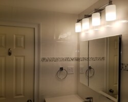 Large medicine cabinet and vanity lights.