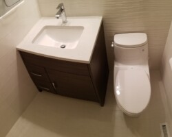 One peace toilet on the tiled floor.