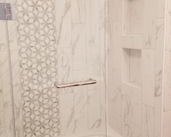 Partial shower door makes access to the tub easier.