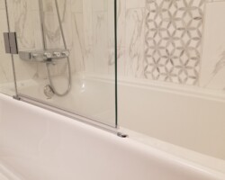 Shower door on the tub.