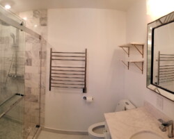 Towel warmer on the wall.