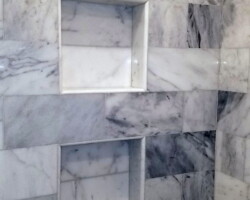 Custom made marble tiled niches.