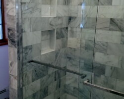 Glass sliding shower doors.