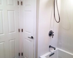Linen closet next to the tub.