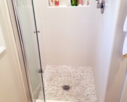 Mosaic shower floor.