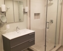 Hanging vanity and recessed medicine cabinet.