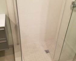 Square drain grill and square tile mosaic.