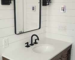 Rustic looking vanity and heated floor.