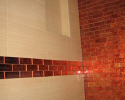 Glass tile accent stripe around whole bathroom.