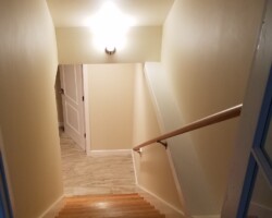New stairs, tile floor, sheetrock on the walls and ceilings.