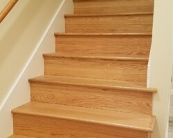 Oak wood steps and raisers on new stair.