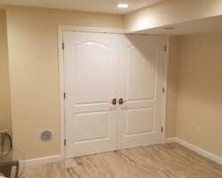 Utility closet with double doors.