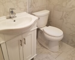 New Toilet, vanity and medicine cabinet.