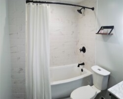 Black trim on white tiles is a classic combination.