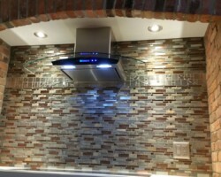 Kitchen backsplash. Tile replacement, new light and range hood.
