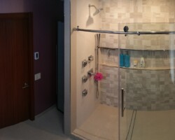 Tall cabinet next to shower.