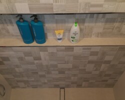 Wide tiled custom niche.