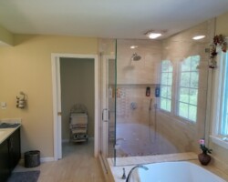 New shower cabin with custom glass walls and door.