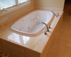 Preserved Jacuzzi next to new shower.