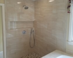 New shower system and custom tiled niche.
