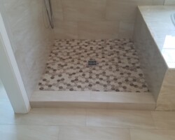 Tiled step to shower.