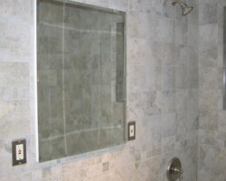 Recessed medicine cabinet with vanity lights.