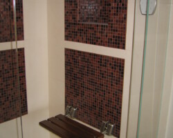 Folding bench inside the steam shower.