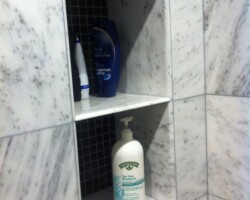 Niche made of the same marble tiles.