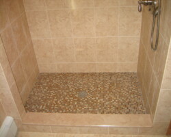 Shower floor made of mosaic tiles.