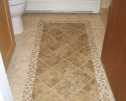 Floor made of combination of porcelain and mosaic tiles.