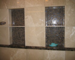 Two niches with shelves made of marble and mosaic.