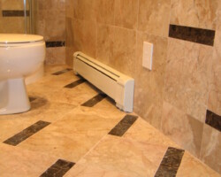 Floor and walls have the same marble tiles and pattern.