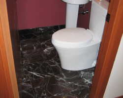 Black marble tiles and baseboards.